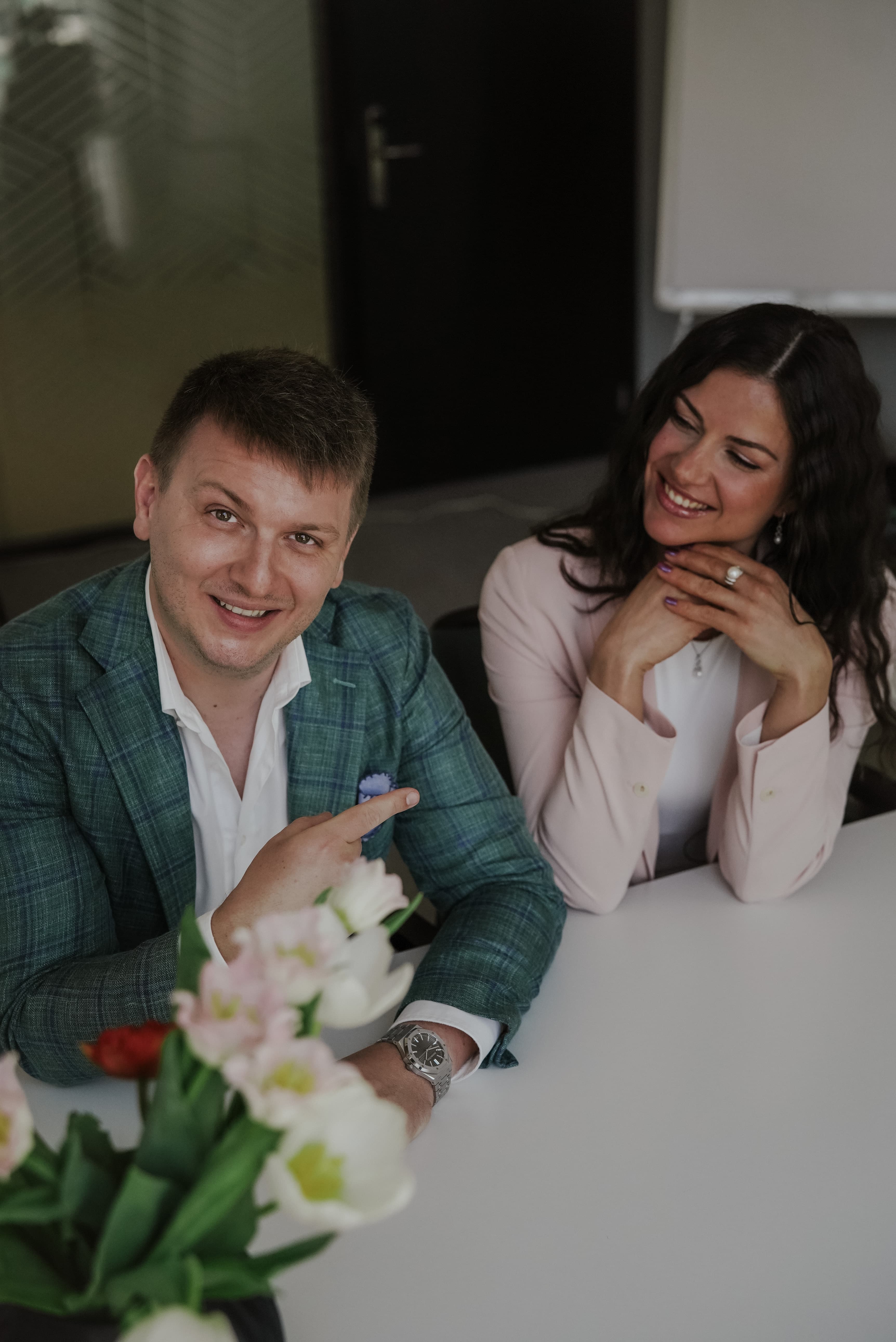Kristina with a client and flowers